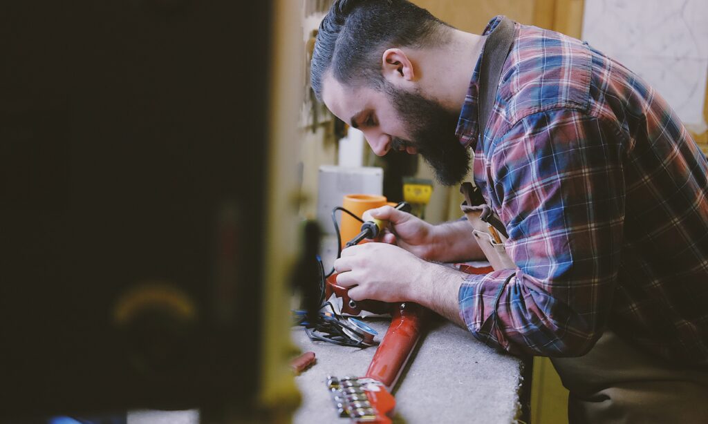 an-edmonton-homeowner-working-on-his-recently-installed-garage-workbench