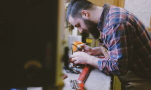 an-edmonton-homeowner-working-on-his-recently-installed-garage-workbench