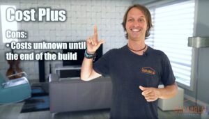 man with neck length hair and black t shirt pointing up while standing in beautiful modern living room.
